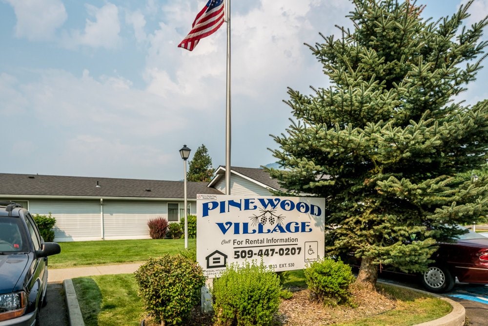 7032 Heritage Street Rathdrum, ID 83858 - Photo 6 of 10 a sign that is on a street