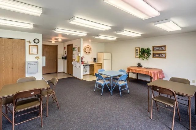 a living room with furniture and a chair