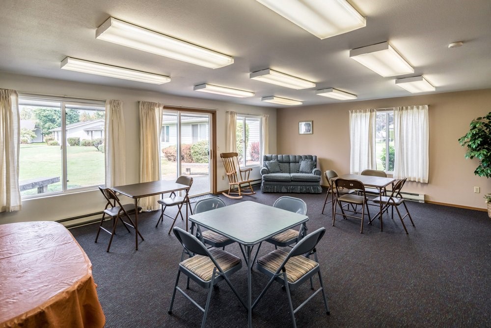 7032 Heritage Street Rathdrum, ID 83858 - Photo 8 of 10 a view of a dining room with furniture and windows
