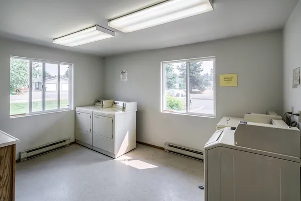 a utility room with a window dryer and washer