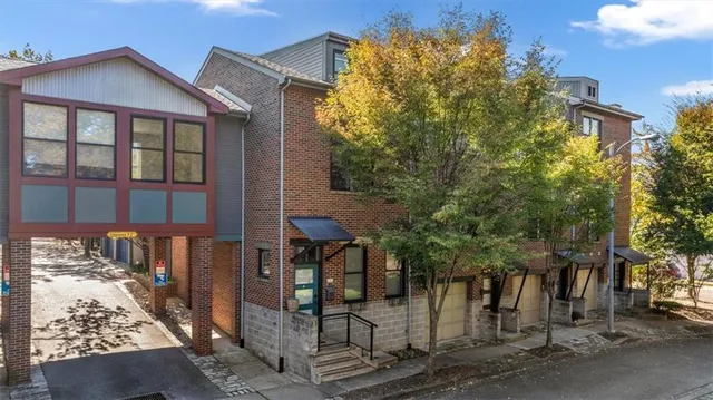 a front view of a house with parking