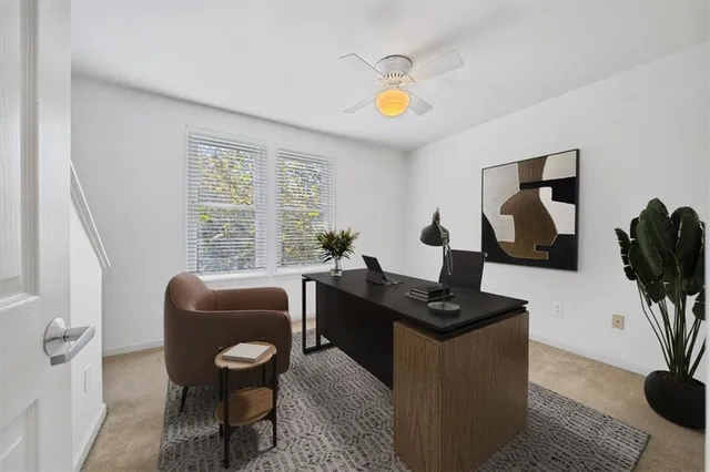 a view of a workspace with furniture