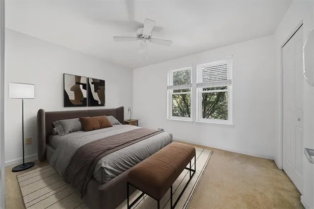 a bed room with a bed and a window