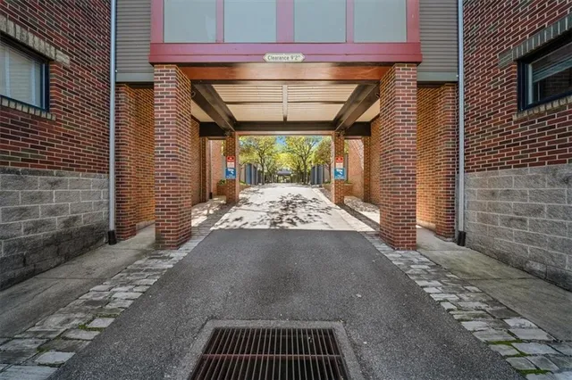 a view of a porch with a table and chairs