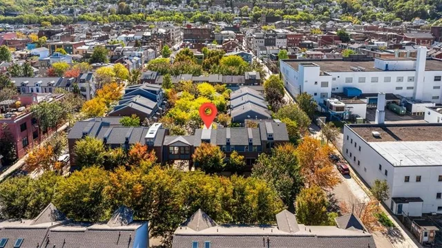 an aerial view of residential houses with outdoor space