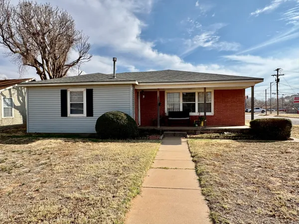 a front view of a house with yard