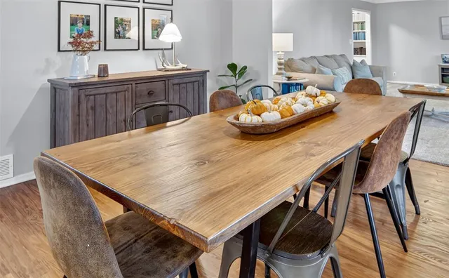 a dining room with furniture and window