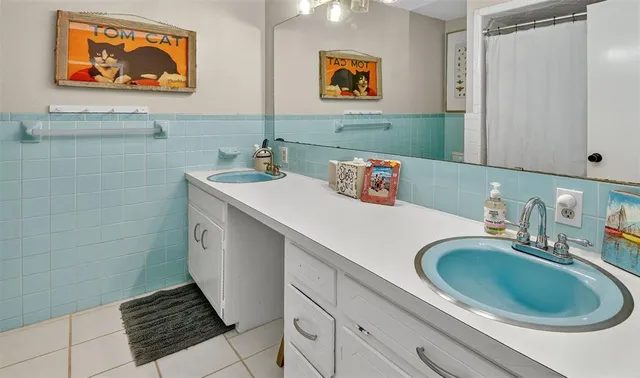 a bathroom with a sink a mirror and a toilet