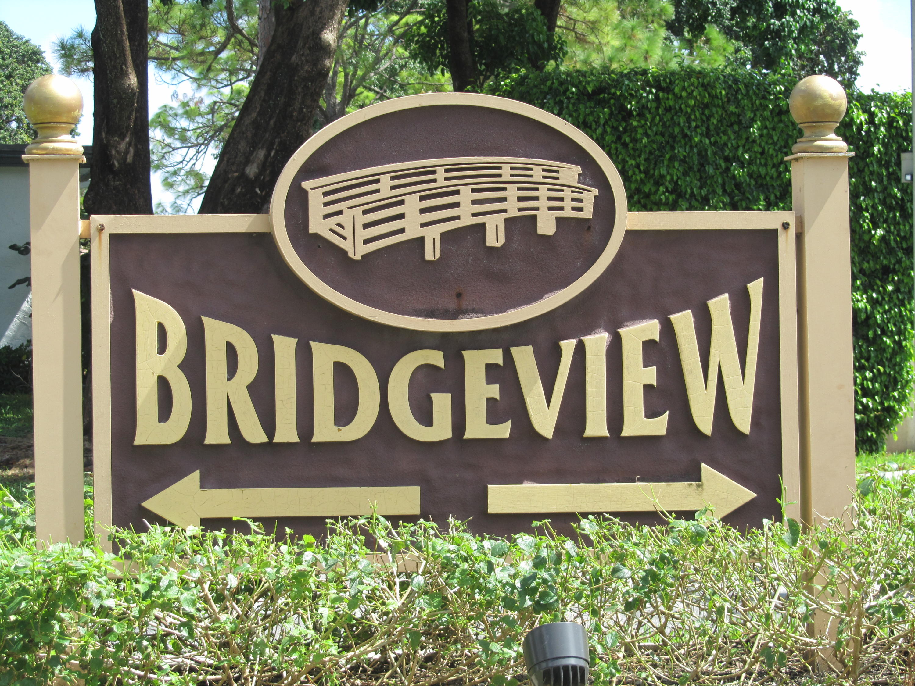 5368 Privet Place, Unit B Delray Beach, FL 33484 - Photo 15 of 15 a view of sign board with yard and trees