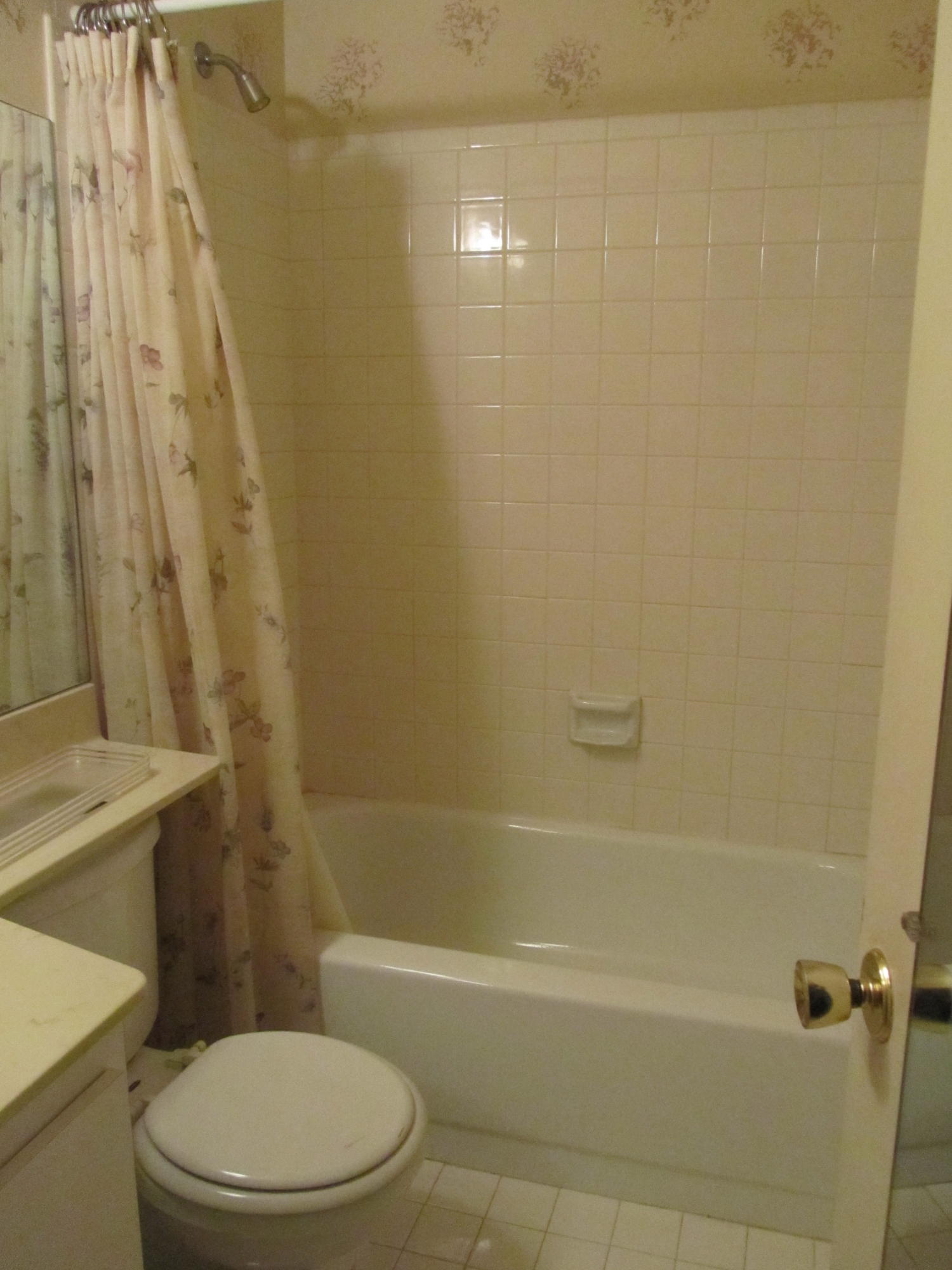 5368 Privet Place, Unit B Delray Beach, FL 33484 - Photo 5 of 15 a white toilet sitting next to a bath tub and a shower