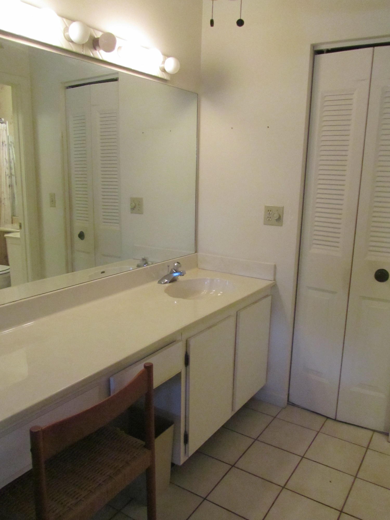5368 Privet Place, Unit B Delray Beach, FL 33484 - Photo 6 of 15 a bathroom with a sink and a mirror