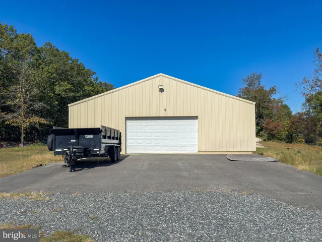 a view of backyard with large trees
