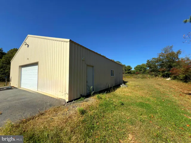 a view of entryway with wooden floor and stairs