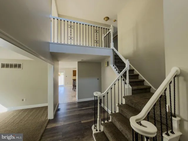 a view of entryway with wooden floor