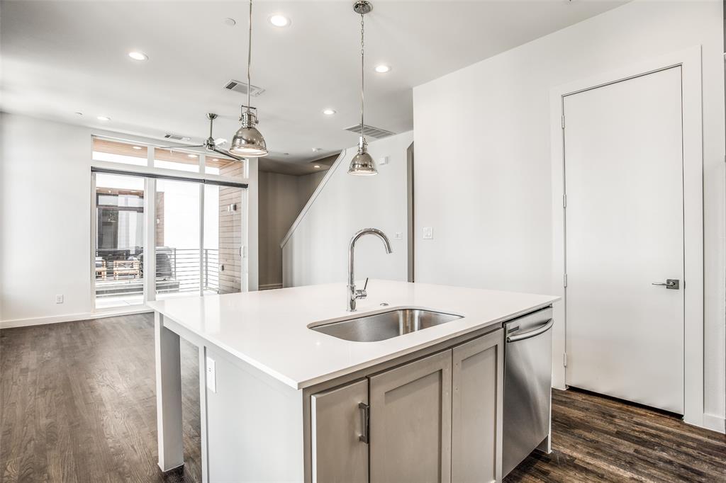 2190 Bennett Avenue, Unit 301 Dallas, TX 75206 - Photo 11 of 21 a view of a kitchen with a sink and wooden floor