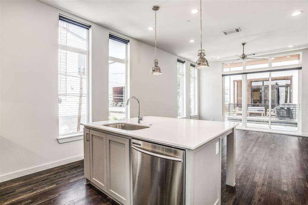 2190 Bennett Avenue, Unit 301 Dallas, TX 75206 - Photo 12 of 21 a kitchen that has a sink a window and wooden floor
