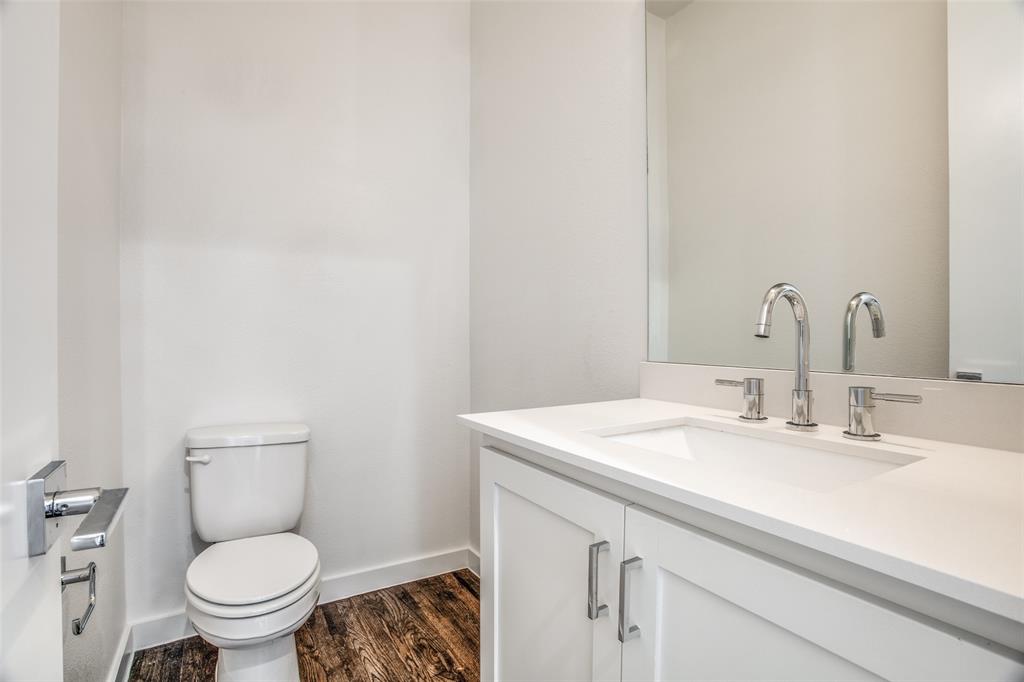 2190 Bennett Avenue, Unit 301 Dallas, TX 75206 - Photo 13 of 21 a bathroom with a sink a toilet and a mirror