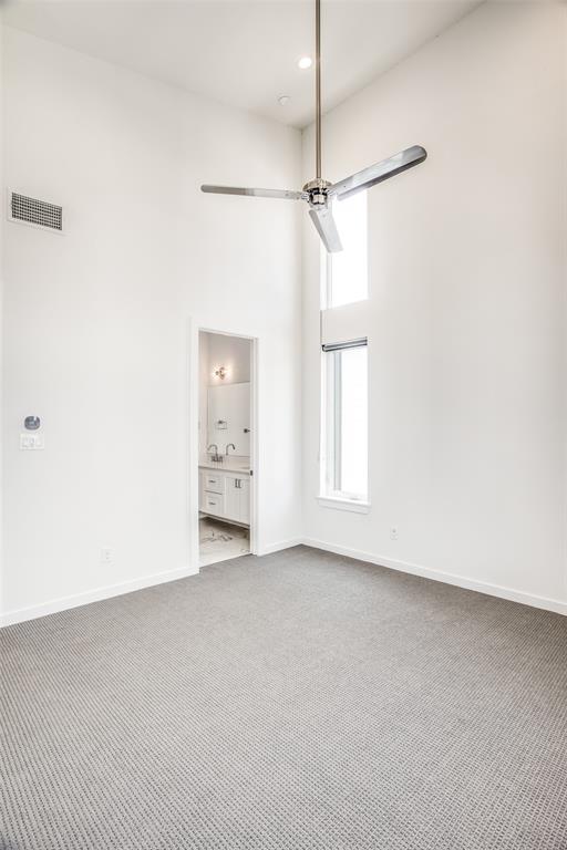 2190 Bennett Avenue, Unit 301 Dallas, TX 75206 - Photo 14 of 21 an empty room with a window and a fan