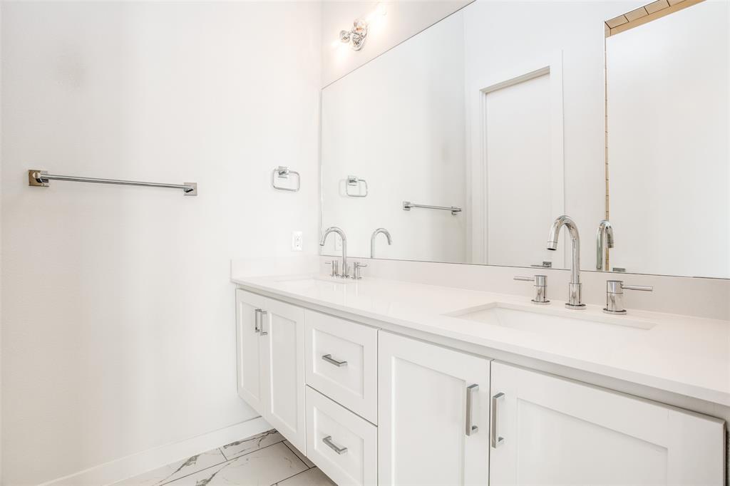 2190 Bennett Avenue, Unit 301 Dallas, TX 75206 - Photo 16 of 21 a bathroom with a sink and a mirror