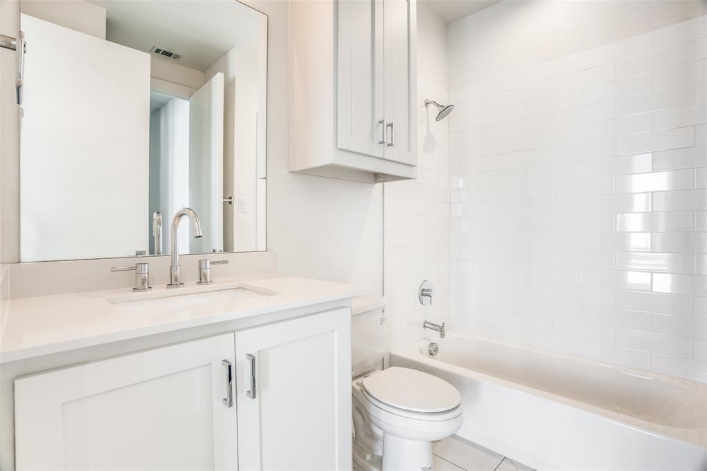 2190 Bennett Avenue, Unit 301 Dallas, TX 75206 - Photo 18 of 21 a bathroom with a sink and a toilet