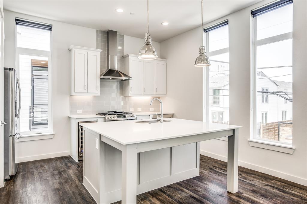 2190 Bennett Avenue, Unit 301 Dallas, TX 75206 - Photo 10 of 21 a kitchen with a stove a sink and wooden floor