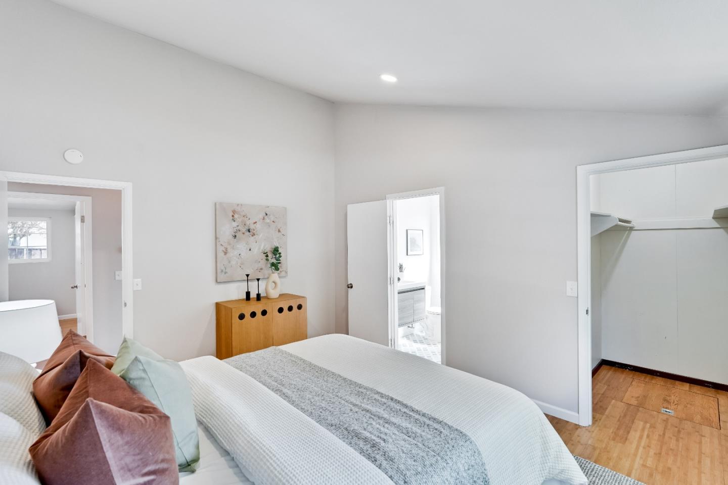 1755 Ravizza Avenue Santa Clara, CA 95051 - Photo 31 of 36 a bedroom with a bed and wooden floor