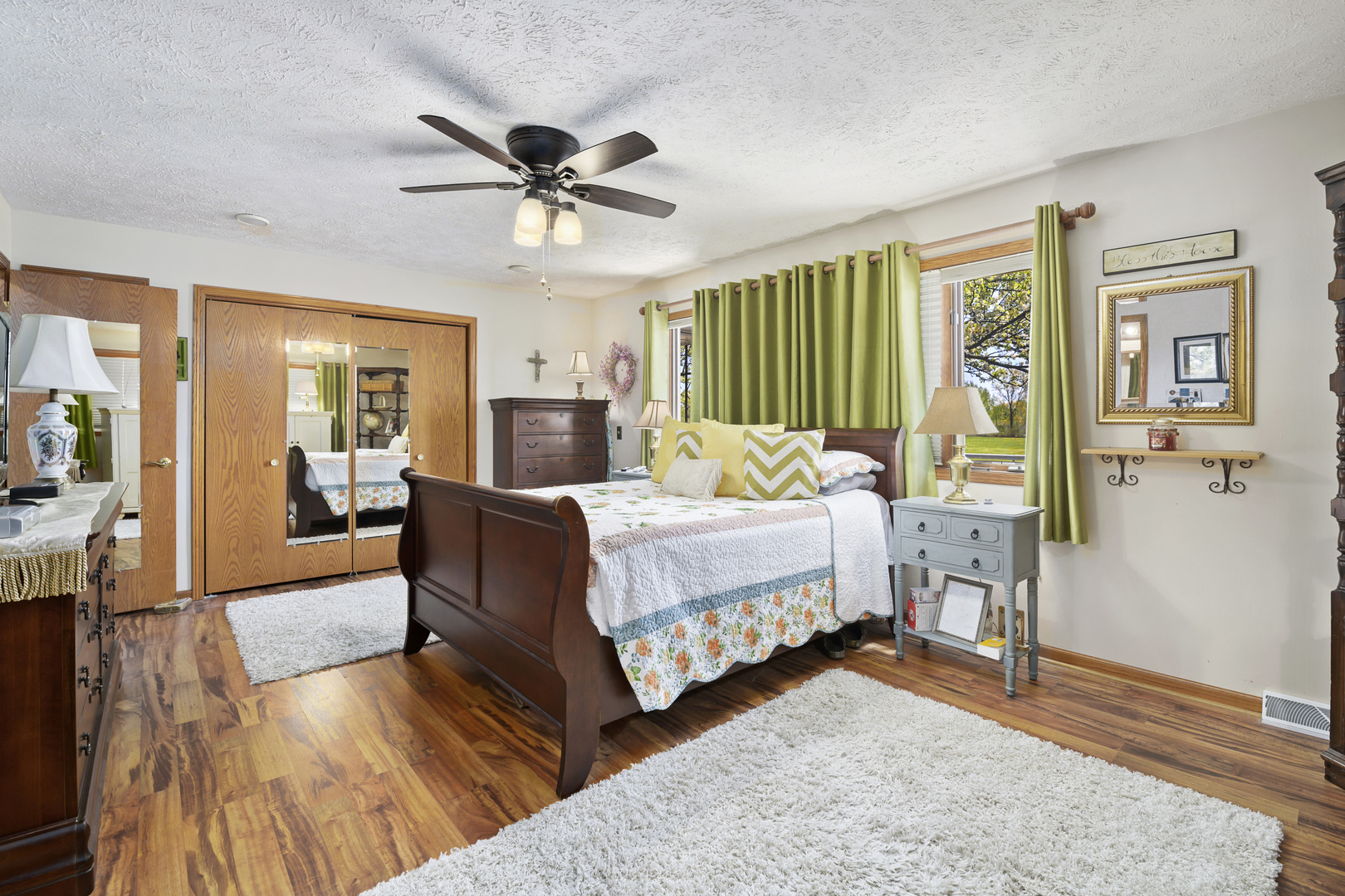 3205 Caton Farm Road Joliet, IL 60431 - Photo 19 of 20 a bedroom with a bed and wooden floor