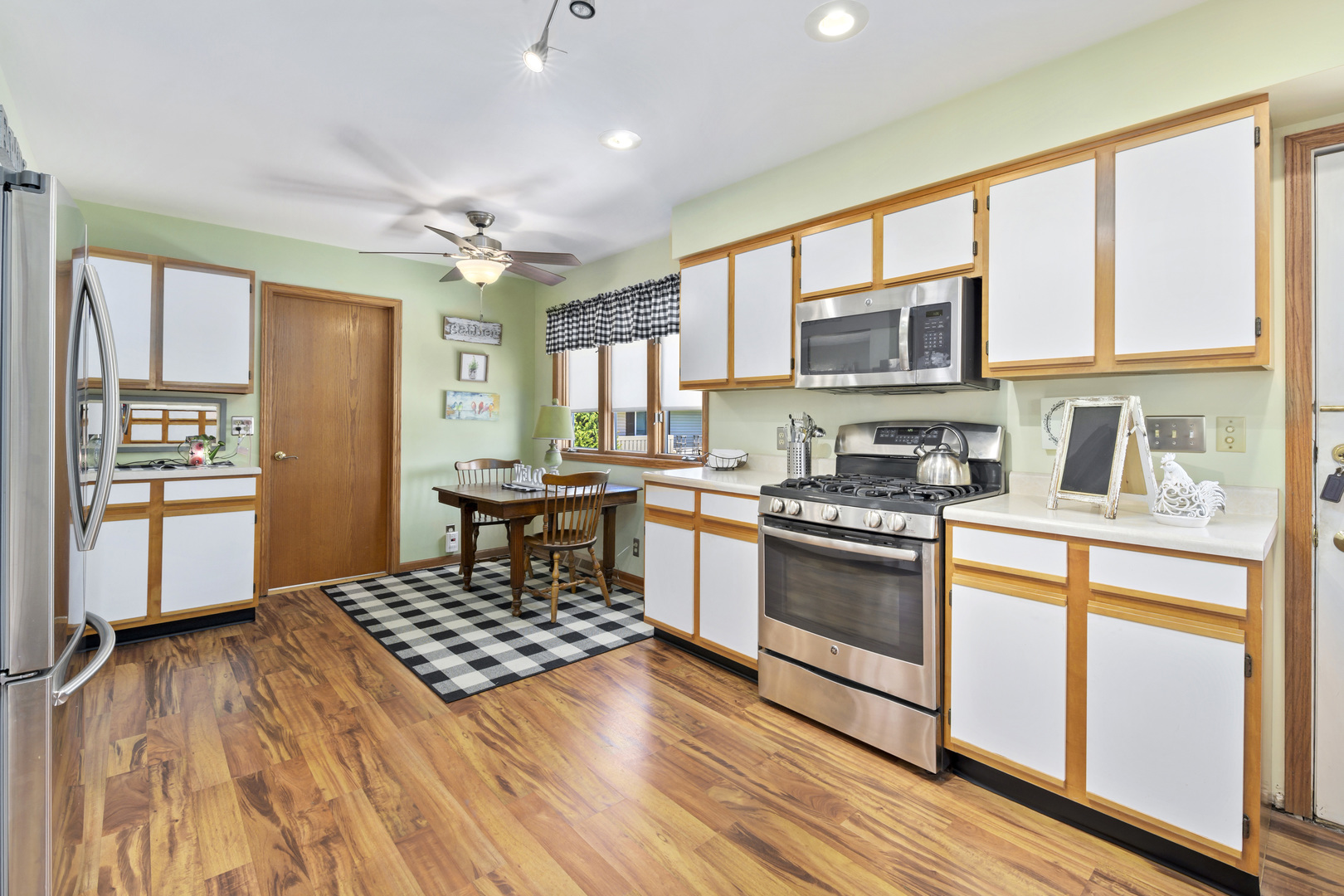 3205 Caton Farm Road Joliet, IL 60431 - Photo 20 of 20 a kitchen with stainless steel appliances granite countertop a stove and a refrigerator