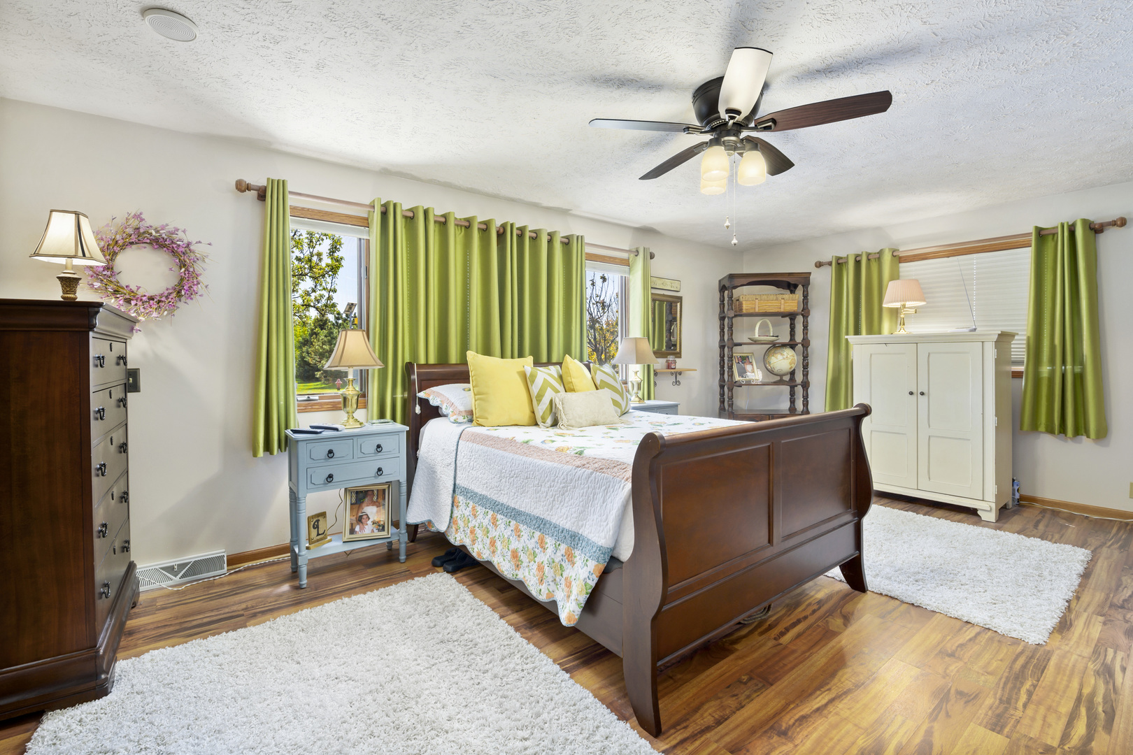 3205 Caton Farm Road Joliet, IL 60431 - Photo 4 of 20 a bed room with a bed and a chandelier