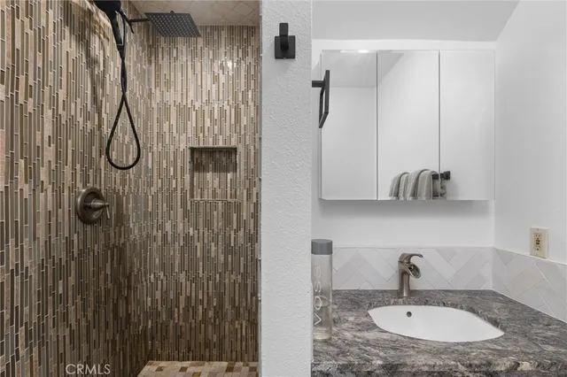 a bathroom with a sink and a mirror