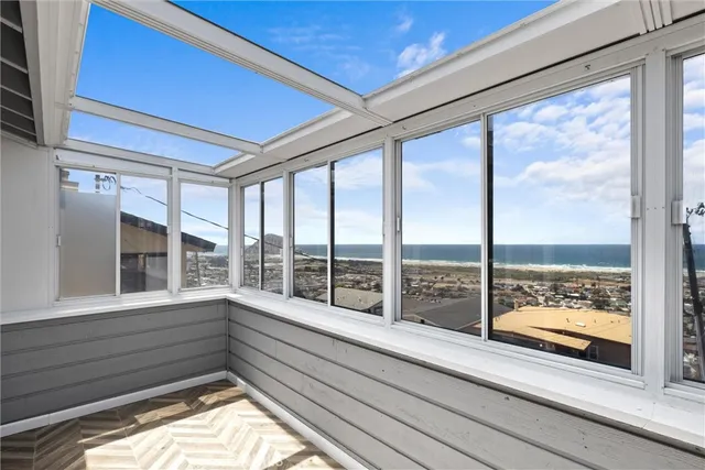 a view of a glass door with a roof deck