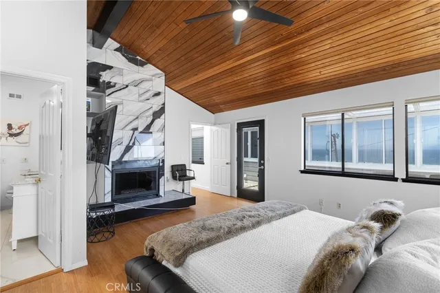 a bedroom with furniture and a fireplace