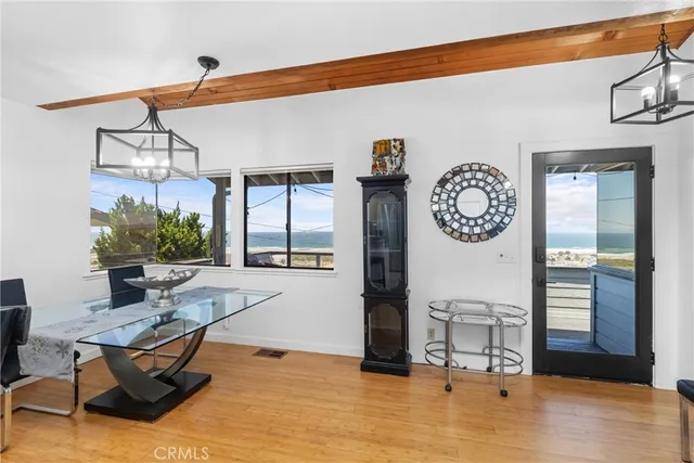 a living room with furniture a window and a chandelier