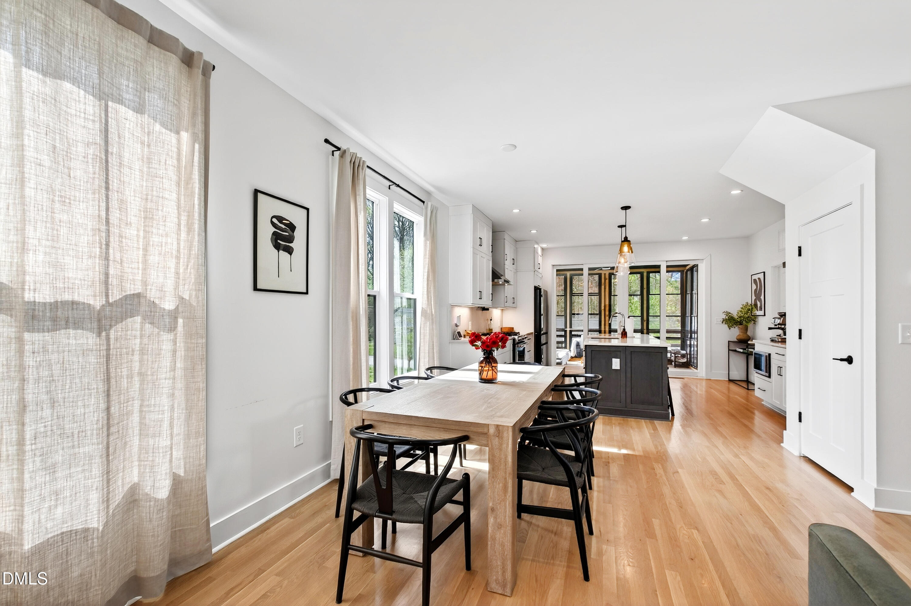 325 Grand Avenue Raleigh, NC 27606 - Photo 11 of 46 a view of a dining room with furniture and wooden floor