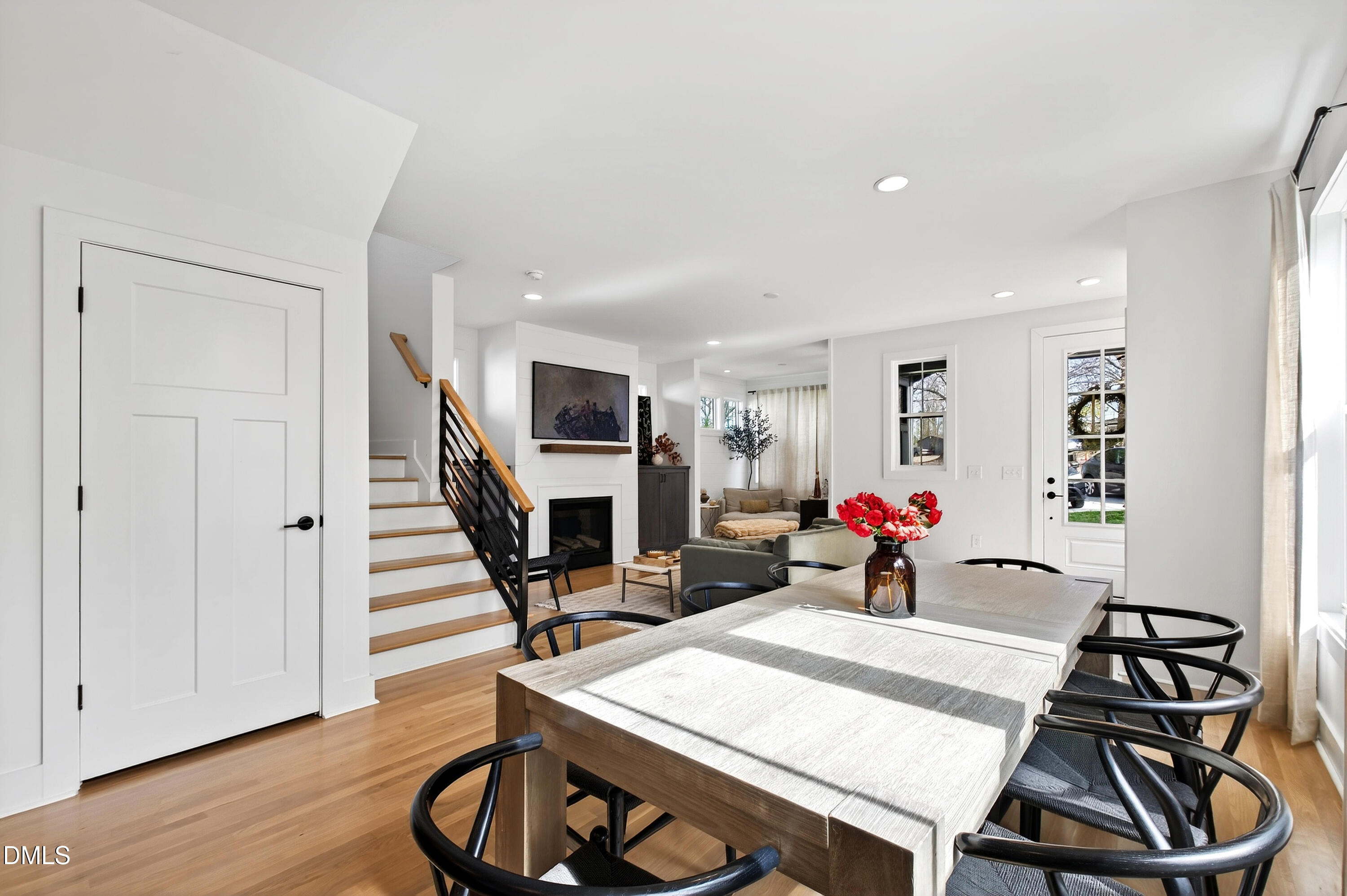 325 Grand Avenue Raleigh, NC 27606 - Photo 12 of 46 a living room with furniture a fireplace and wooden floor
