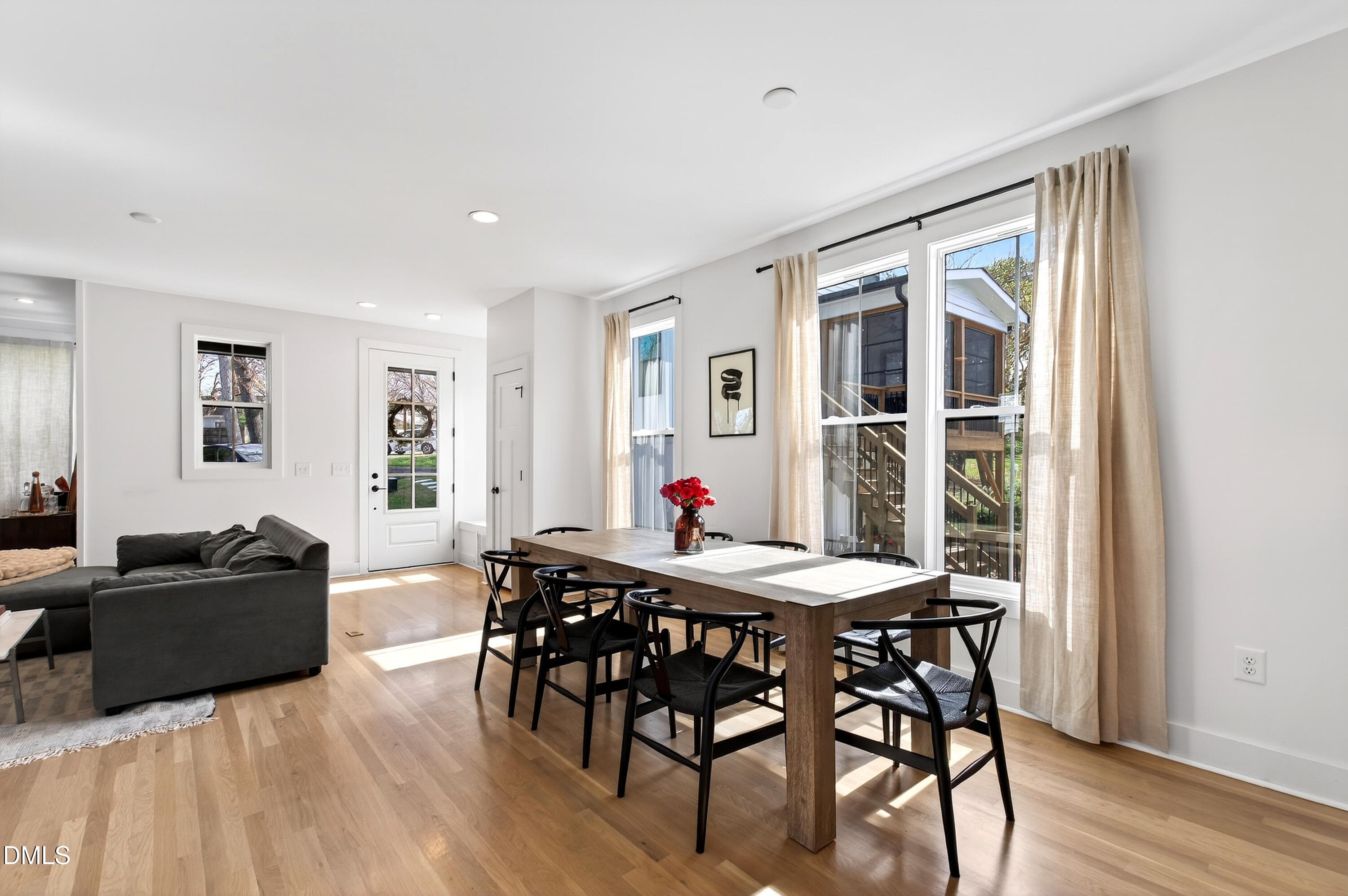 325 Grand Avenue Raleigh, NC 27606 - Photo 13 of 46 a view of a dining room with furniture window and wooden floor