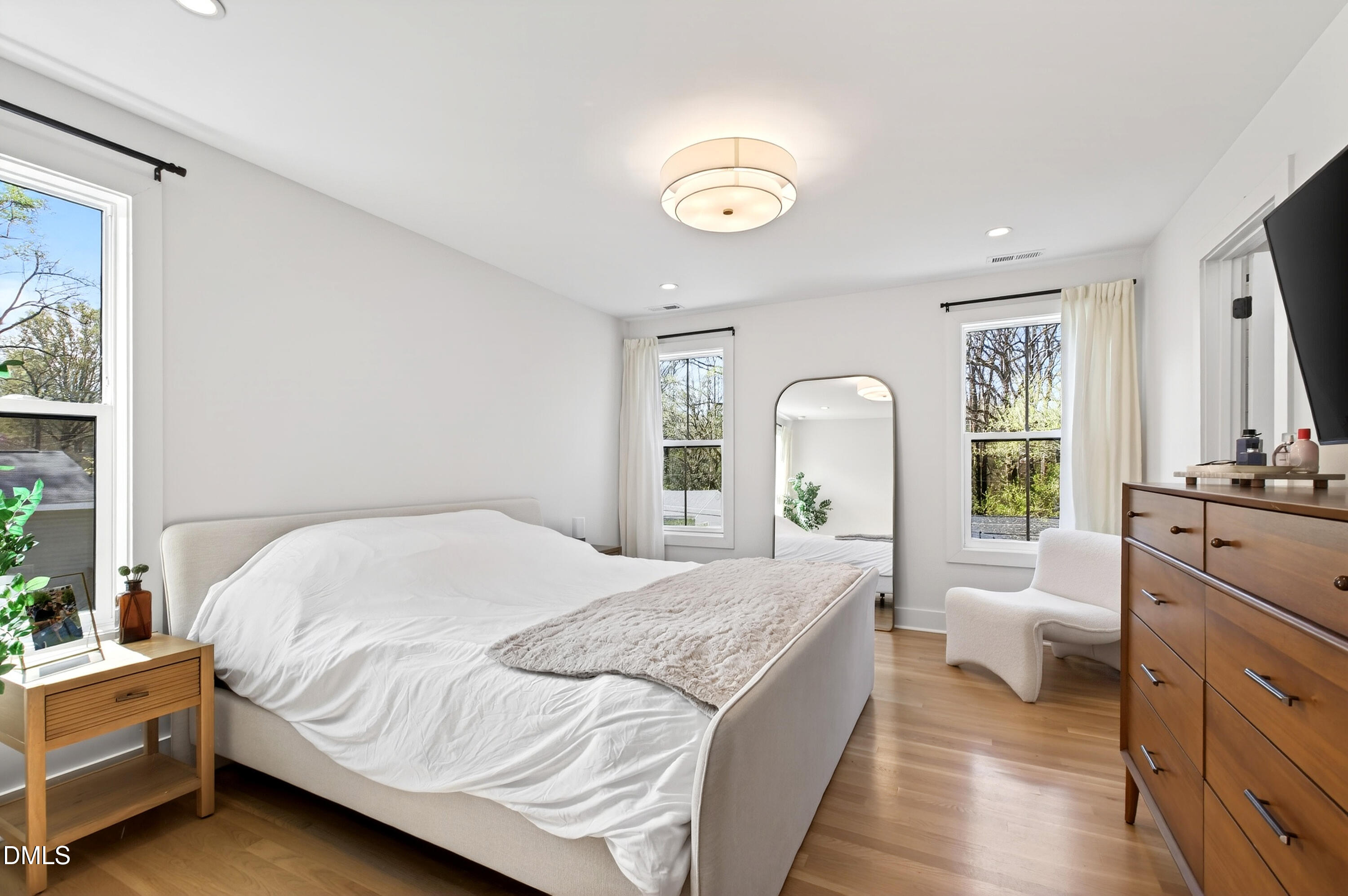 325 Grand Avenue Raleigh, NC 27606 - Photo 25 of 46 a bedroom with a bed and a large window
