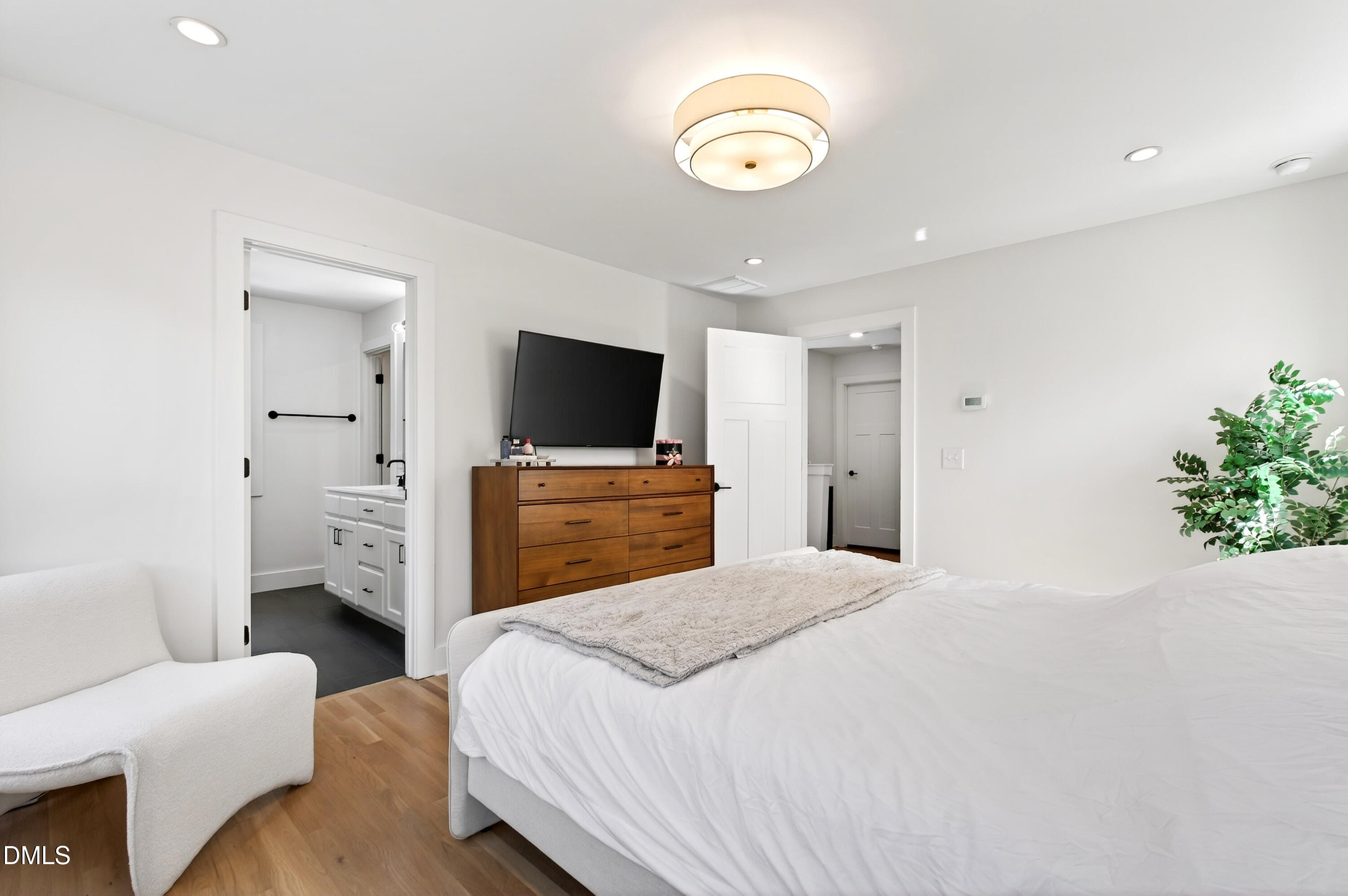 325 Grand Avenue Raleigh, NC 27606 - Photo 26 of 46 a bedroom with a bed and a television