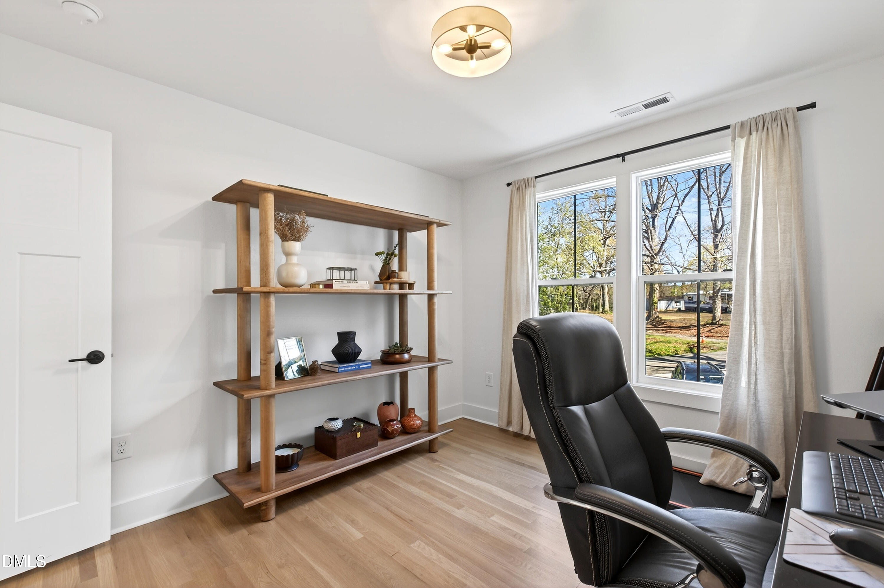 325 Grand Avenue Raleigh, NC 27606 - Photo 31 of 46 a view of a workspace with furniture and a window
