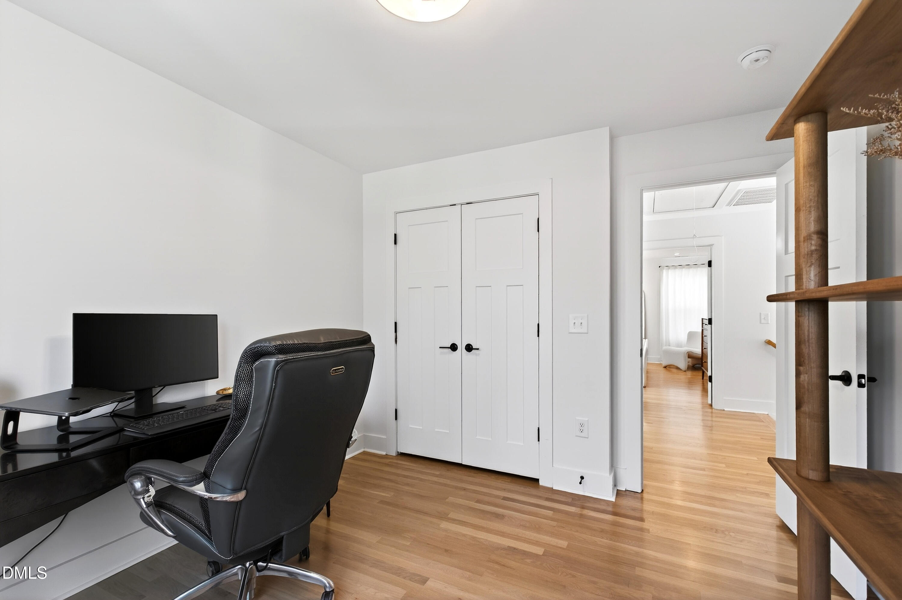 325 Grand Avenue Raleigh, NC 27606 - Photo 32 of 46 a view of a workspace with furniture and wooden floor