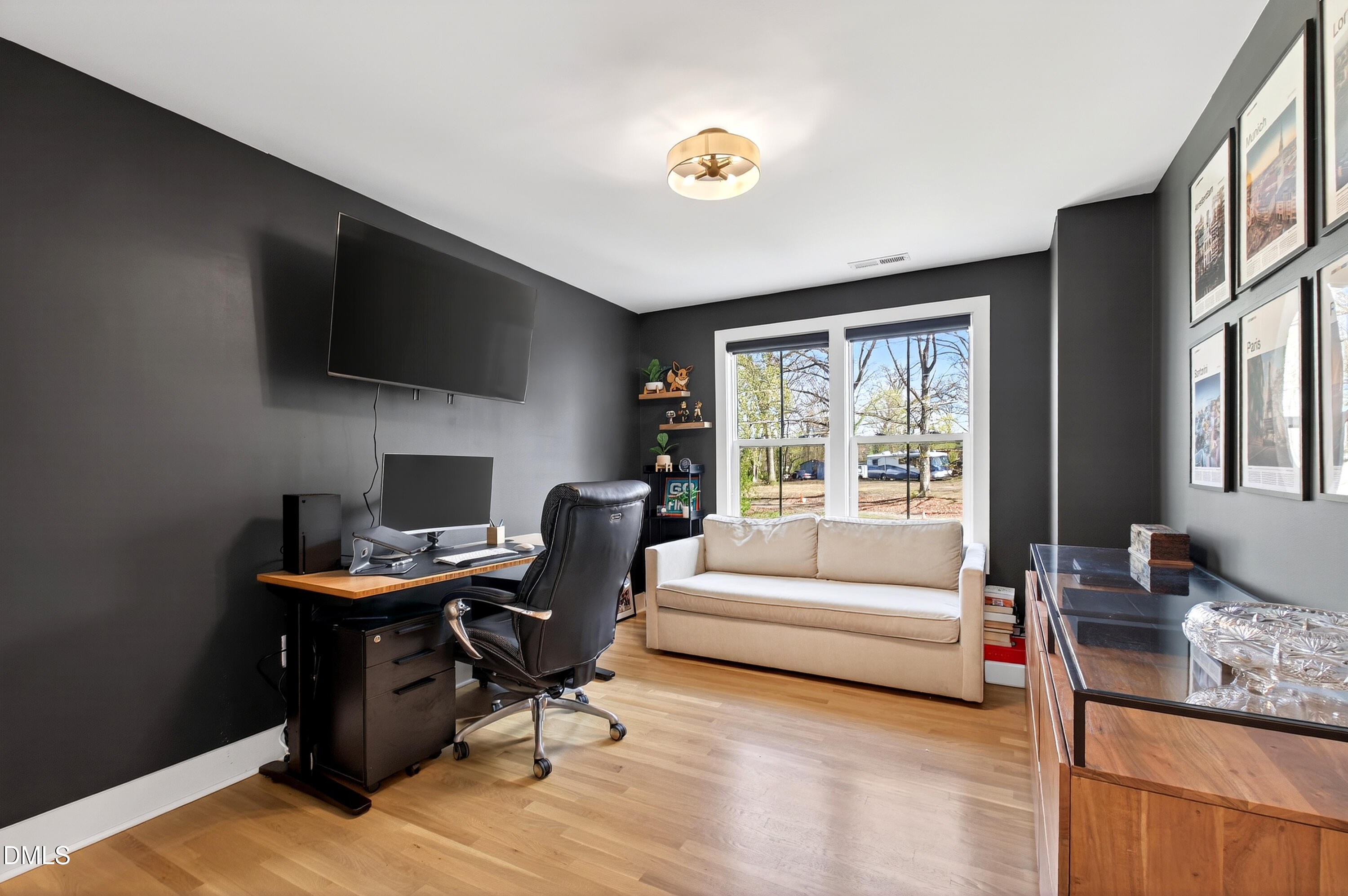 325 Grand Avenue Raleigh, NC 27606 - Photo 33 of 46 a living room with furniture and a flat screen tv