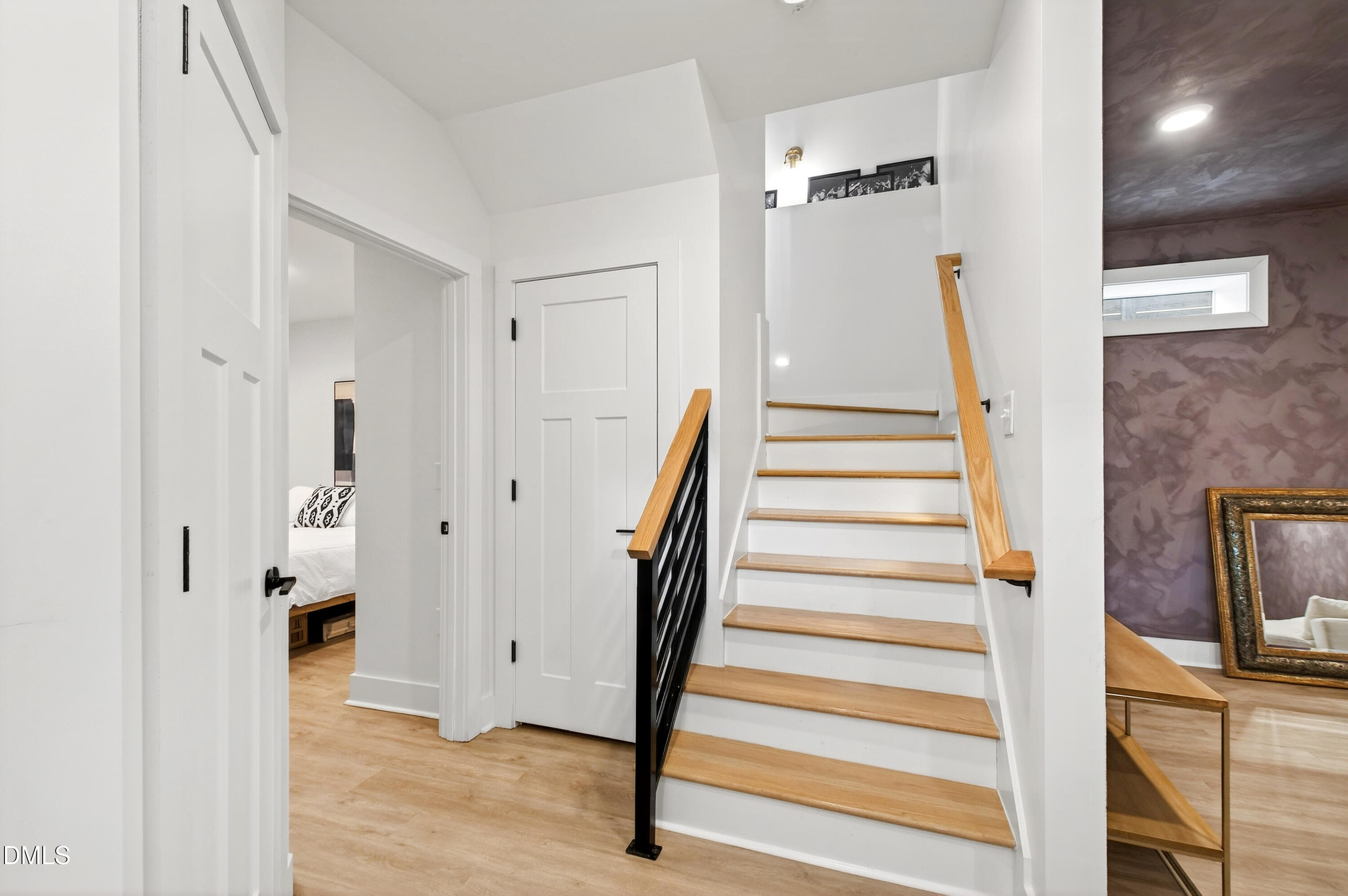 325 Grand Avenue Raleigh, NC 27606 - Photo 35 of 46 a view of a hallway with wooden floor and staircase