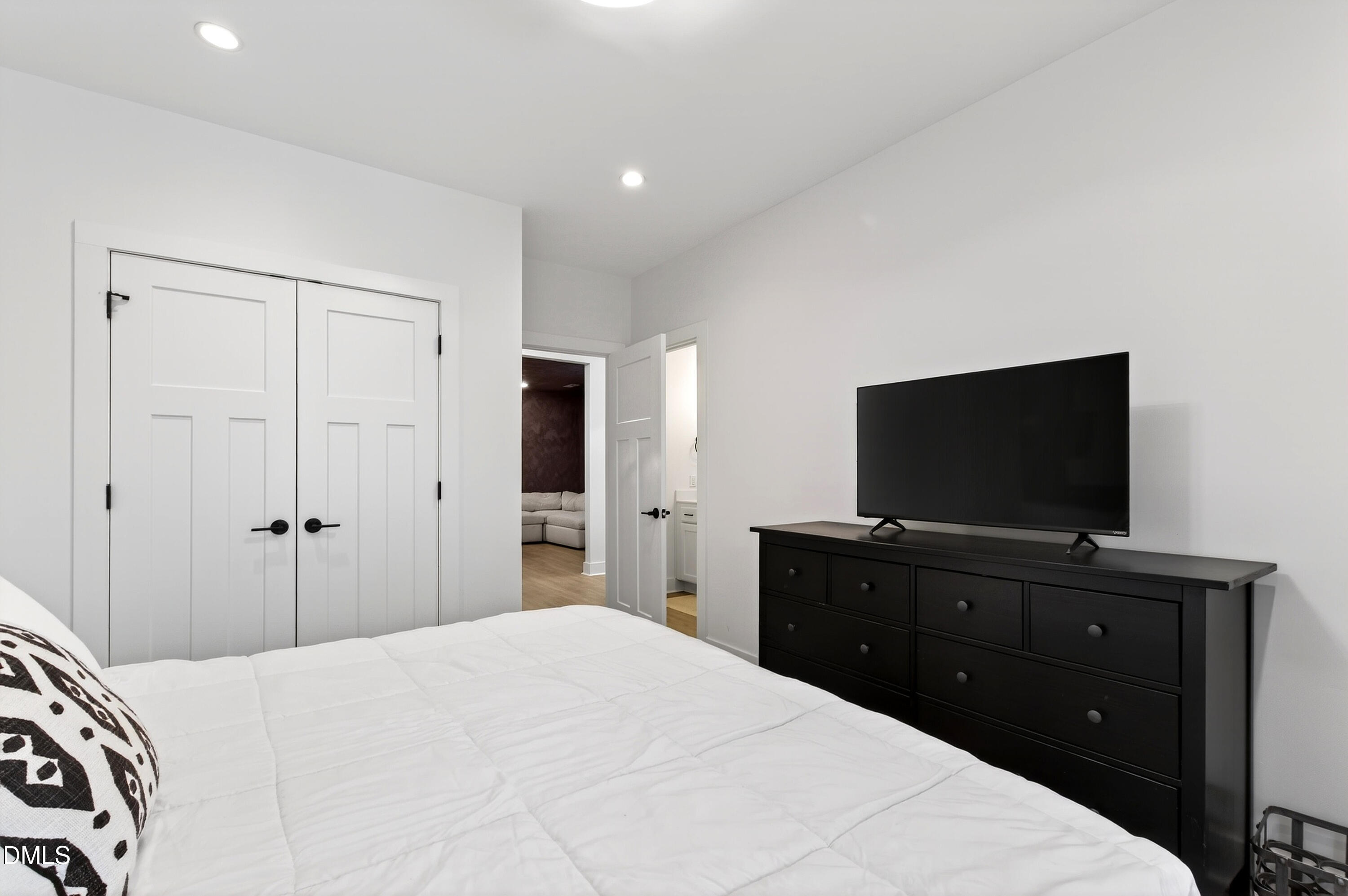 325 Grand Avenue Raleigh, NC 27606 - Photo 40 of 46 a bedroom with a bed and a flat screen tv in it