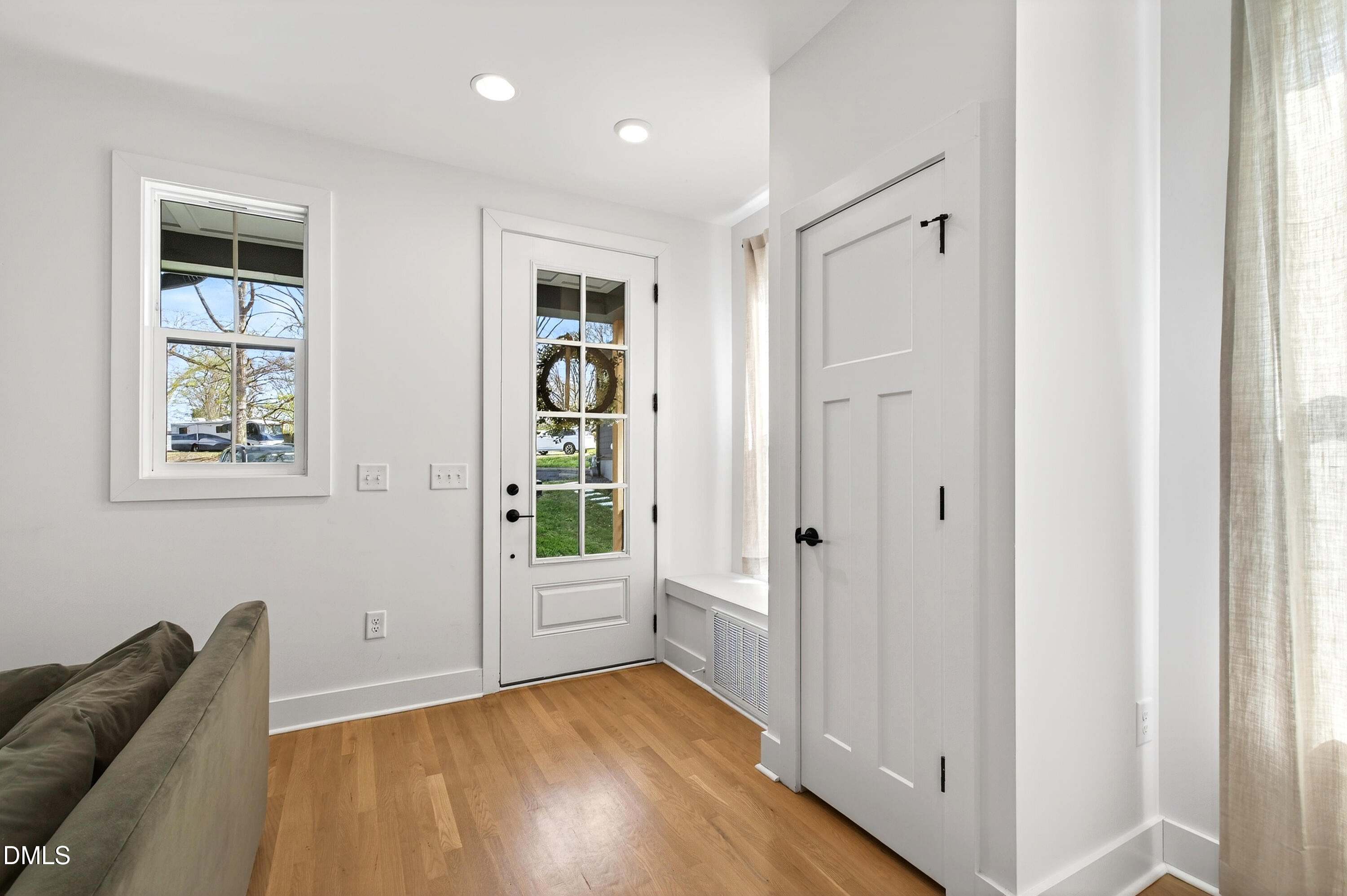 325 Grand Avenue Raleigh, NC 27606 - Photo 4 of 46 a view of livingroom with hardwood floor and hallway