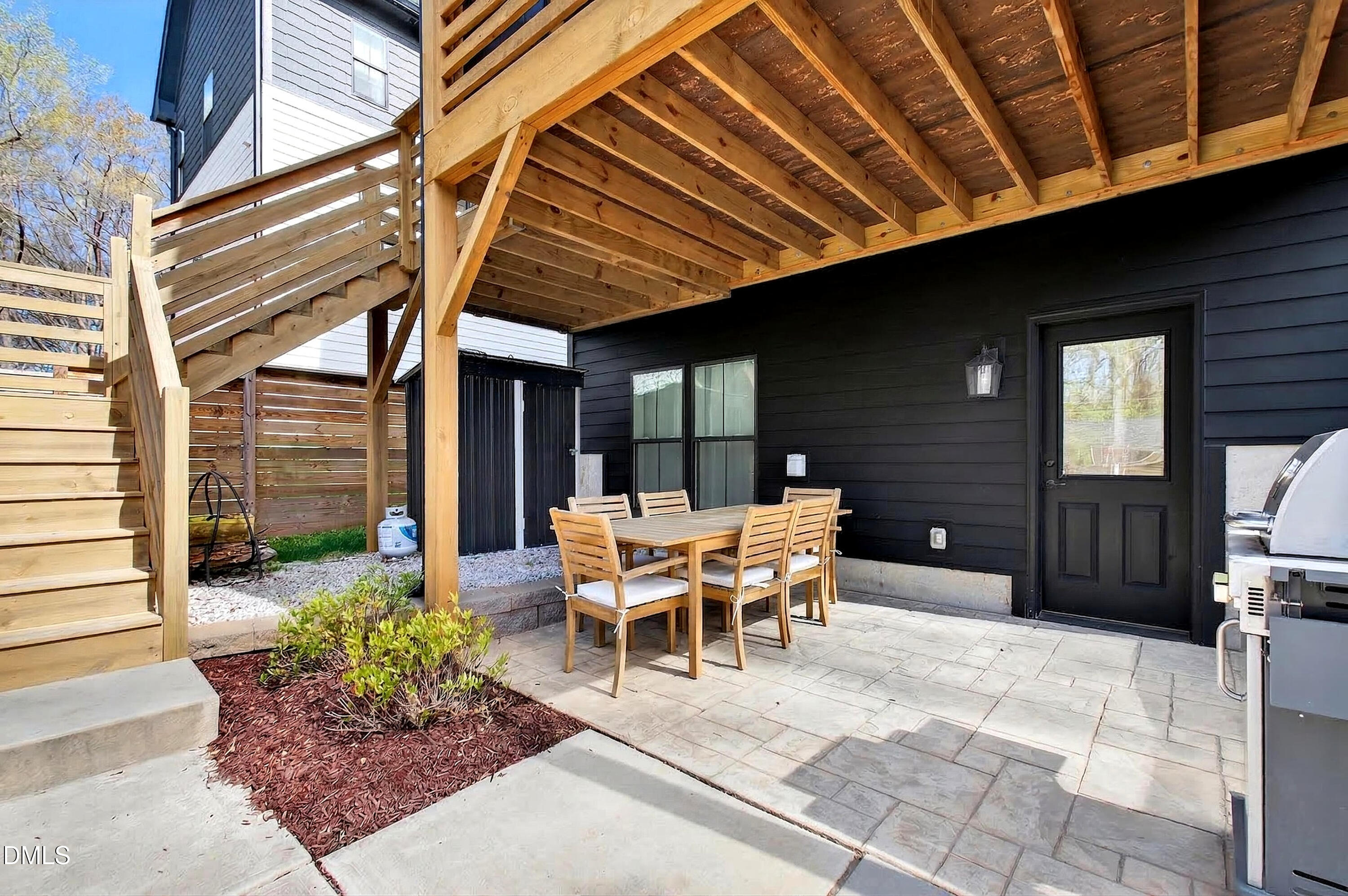 325 Grand Avenue Raleigh, NC 27606 - Photo 43 of 46 a patio with table and chairs and potted plants