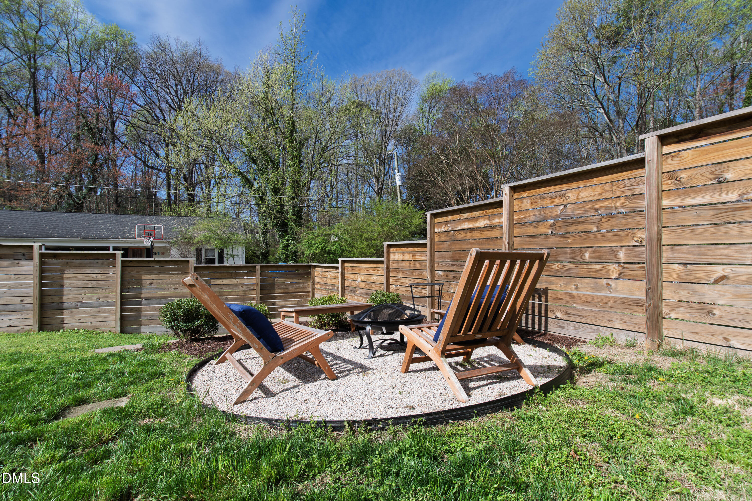 325 Grand Avenue Raleigh, NC 27606 - Photo 45 of 46 a view of a chair and table in the backyard