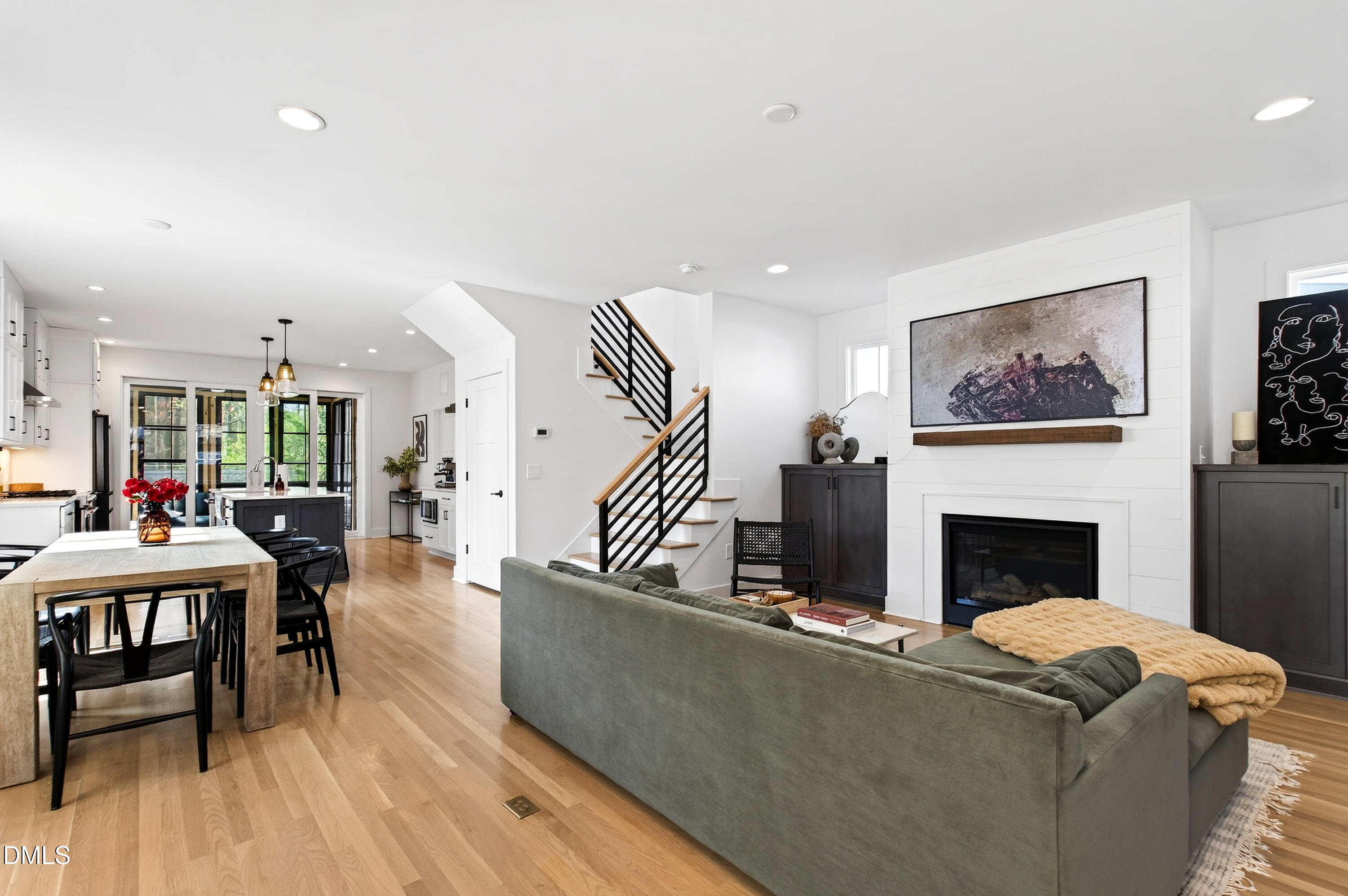 325 Grand Avenue Raleigh, NC 27606 - Photo 5 of 46 a living room with furniture a fireplace and wooden floor