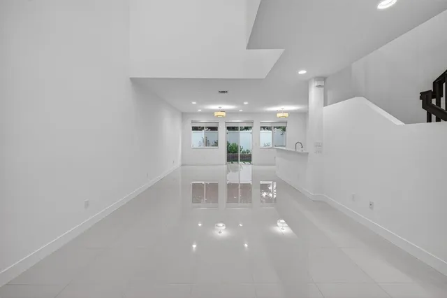 a view of an empty room with a entryway