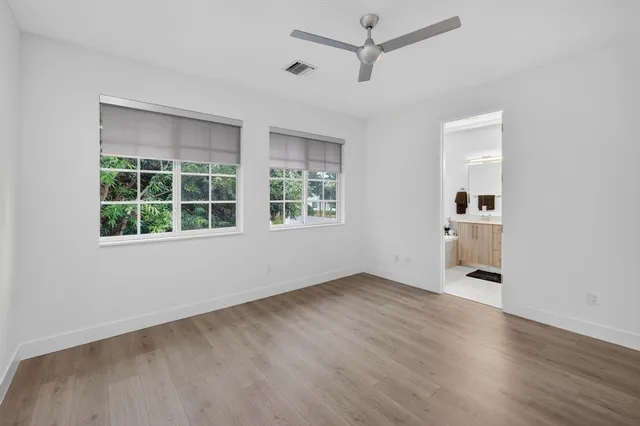 a bathroom with a double vanity sink mirror and shower