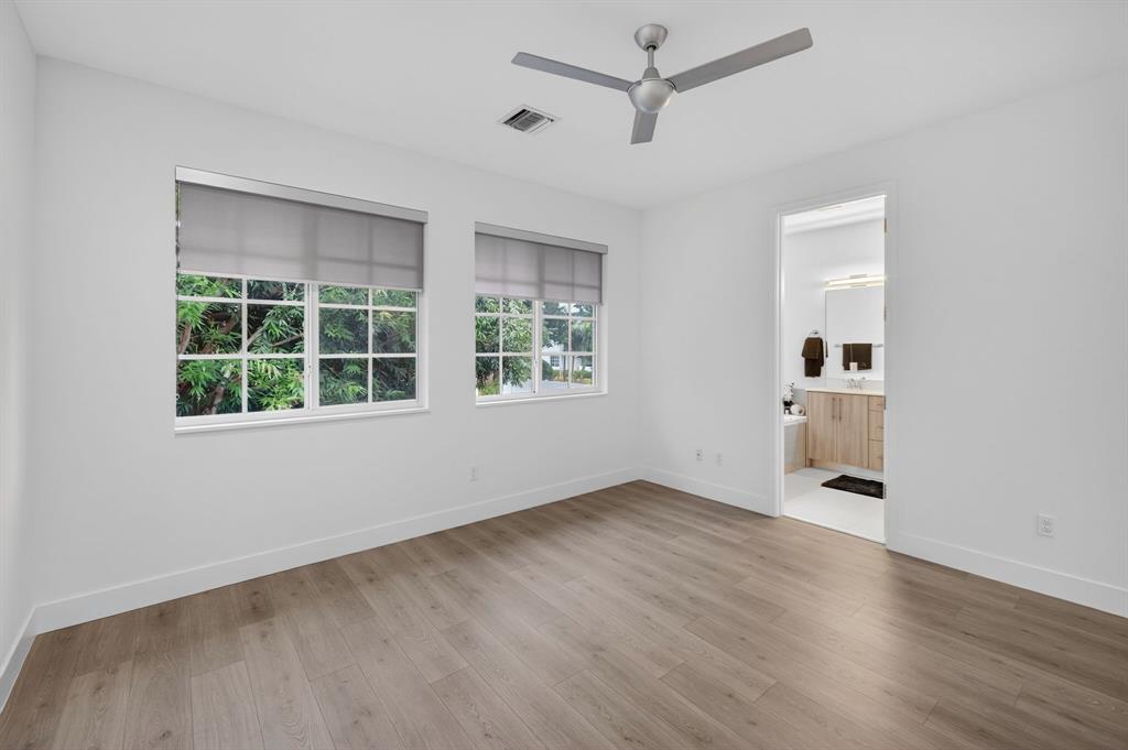 737 Southeast 1st Court, Unit 737 Pompano Beach, FL 33060 - Photo 26 of 53 wooden floor in an empty room with a window